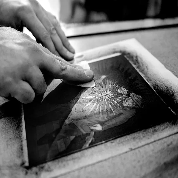 Polishing artwork in the studio